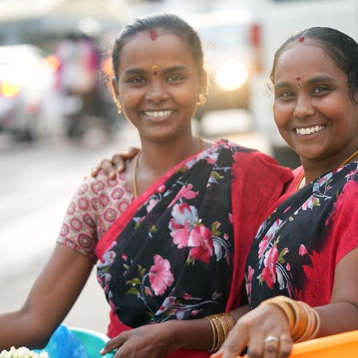 Alex Renner, Lead Design Curator at CedarShoreVista, reviewing corporate floral arrangements